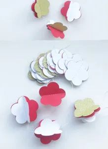 3D paper flower garland detail, colorful hanging decoration for party and room setup.
