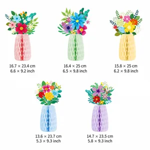 Easter party honeycomb paper flower vase table centerpiece decorations set with floral arrangements.