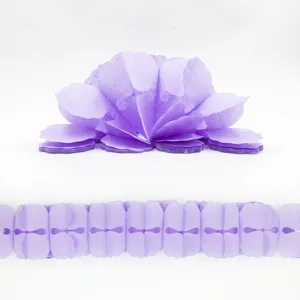 Detail view of purple paper flower garland, lightweight tissue paper for party wedding decor.