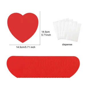 Red heart paper cutouts detail view with dimension and adhesive dots for party decoration.