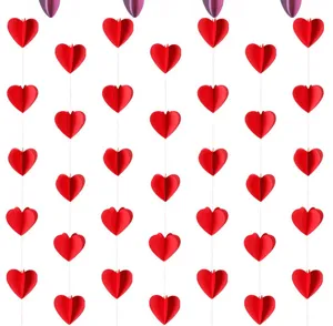 Detailed view of red 3D paper heart hanging garland for festive party and room decoration.
