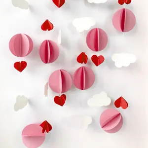 3D paper hanging decoration with pink clouds and red hearts for children birthday party decor.