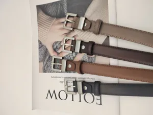 Detail view of versatile women leather belts in multiple colors with metal buckles for jeans.