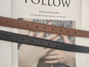 Detail view of women genuine leather belt featuring clean stitching and classic metal eyelets.