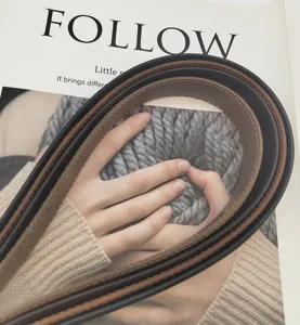 Close-up detail of women's genuine leather belt in multiple colors, elegant and versatile.