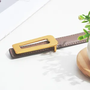 Stylish brown leather belt for women featuring a modern gold-tone geometric buckle chic.