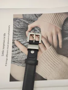 Close-up detail view of the black genuine leather belt with a sleek silver square buckle.