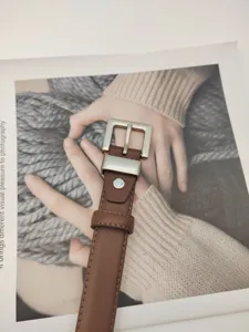 Women brown genuine leather belt with silver square buckle, stylish waist accessory for pants.