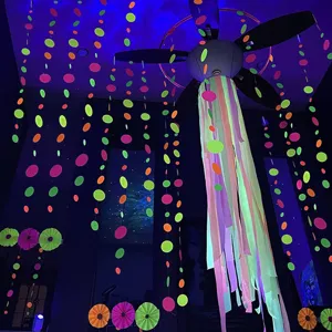 Neon paper garland circles UV reactive party hanging decorations glow in the dark room decor.