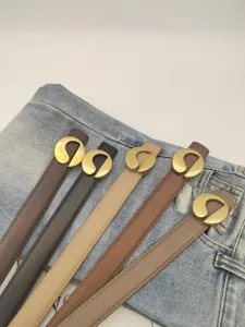 Women genuine leather belt with unique gold metal buckle, stylish accessory for jeans and dress.