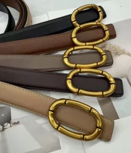 Women's genuine leather belt featuring a chic gold bamboo buckle, perfect for jeans.