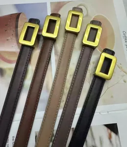 Detail shot of women's genuine leather thin belt with gold square buckle, minimalist fashion.