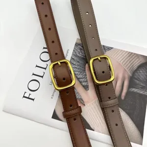 Detail shot of minimalist women leather belts with gold square buckles in brown and grey.