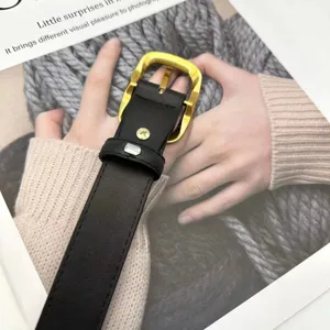 Classic black leather belt featuring a sleek polished gold buckle, premium detail view.