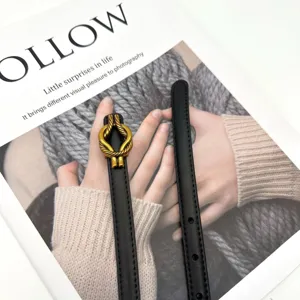 Minimalist black leather belt for women with elegant gold rope knot buckle for chic styling.
