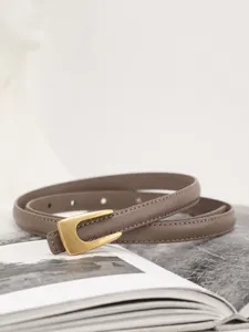 Minimalist genuine leather thin belt for women, elegant casual waist accessory for dresses.