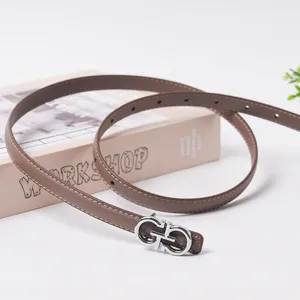 Elegant brown leather belt for women featuring silver buckle minimalist fashion design.