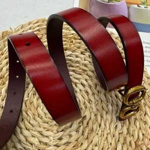 Detailed view of the women's genuine leather belt in rich red with vintage gold buckle.