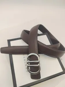 Detail shot of the brown leather belt with silver buckle, featuring fine stitching and texture.