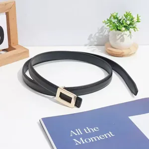 Minimalist black leather belt with gold square buckle close-up view detail accessory