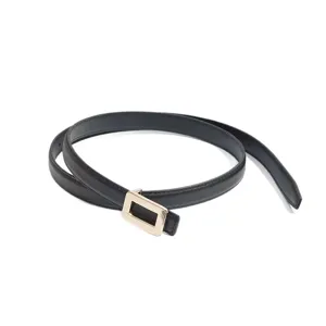 Minimalist fashion women's thin leather belt with gold rectangular buckle for dress and jeans.