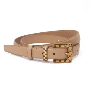Detailed view of women leather belt featuring vintage gold geometric buckle, exquisite accessory.