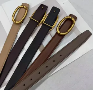 Women's genuine leather belt with metallic oval buckle, stylish accessory for jeans.