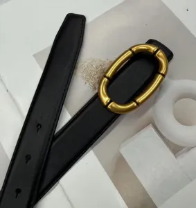 Minimalist women's black leather belt featuring a chic gold segmented oval buckle detail.