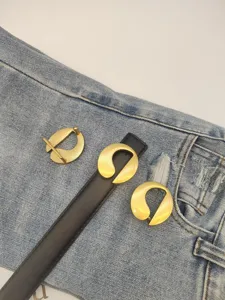 Women black leather belt with unique gold metal buckle chic waist accessory for jeans suit.
