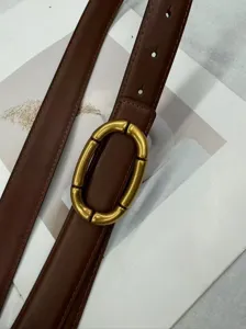 Elegant women's genuine leather belt featuring a chic gold oval buckle for stylish daily wear.