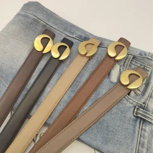 Stylish women's leather belt with unique gold metal buckle, versatile casual jean accessory.