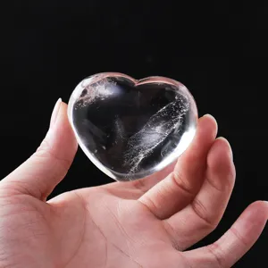 Handcrafted natural clear quartz heart crystal gemstone for healing energy and home decor.