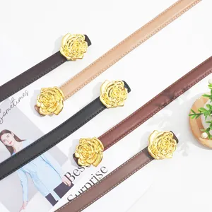 Detailed view of women's thin leather belt featuring an elegant gold rose flower buckle.