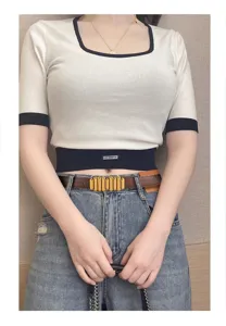 Stylish contrast trim short sleeve knit top paired with fashion metal buckle belt and blue denim.