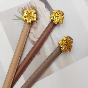 Women thin leather belt set with elegant gold maple leaf buckle for dresses and suits fashion.