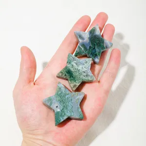 Detail shot of natural green moss agate star crystal showing unique pattern and texture.
