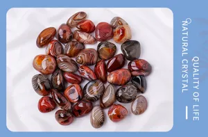 Detailed close-up of natural banded agate tumbled stones, perfect for aquarium decor and crystal display.