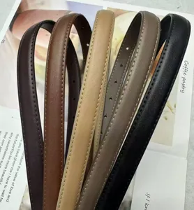 Detailed closeup of multi-color thin women's leather belts with fine stitching and chic design.
