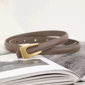 Minimalist women leather belt with stylish gold buckle, elegant thin waist accessory for dress jeans.