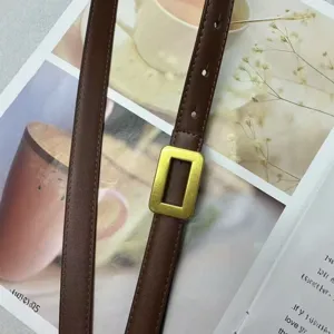 Women's genuine leather thin belt with elegant gold rectangular buckle, chic minimalist waist.
