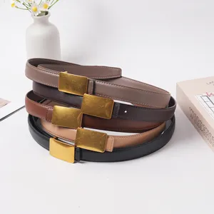 Detailed view of genuine leather belts with gold-tone alloy buckles, casual versatile stack.