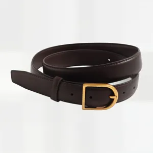Detailed view of women's dark brown leather belt with elegant gold buckle. Premium accessory.