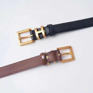 Detailed view of women's leather belts in black and brown with metal H buckles for daily wear.