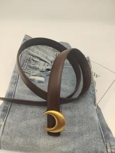 Brown leather belt with gold crescent moon buckle chic denim jeans waist accessory stylish