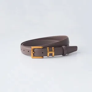 Women's genuine leather belt with gold H-shaped alloy buckle, elegant detail view.
