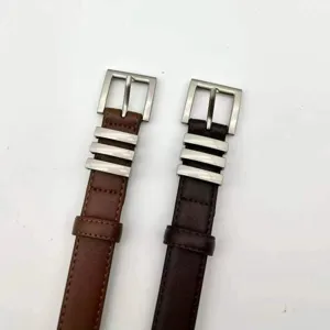 Women's genuine leather thin belt detailed view, stylish decorative waist strap for jeans.