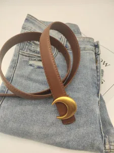 Women brown leather belt with gold crescent moon buckle for jeans dresses casual outfits.