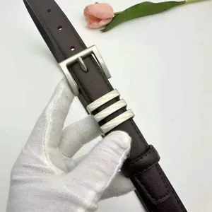 Detailed view of women's leather belt with stylish silver buckle and premium finish.