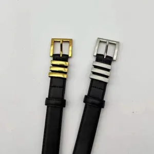 Detailed view of women's black leather belts featuring gold and silver metal buckles.