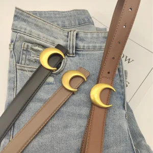 Women leather belt set with stylish gold crescent moon buckle design for jeans and dresses.